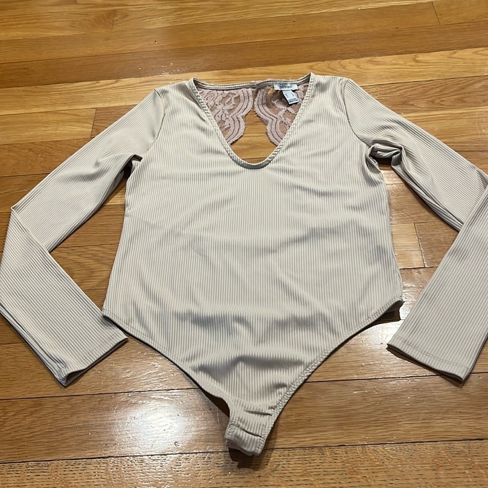 Revamped tan lace one piece body suit size medium.